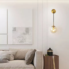Applique Murale dorée avec Boule de Verre Transparent